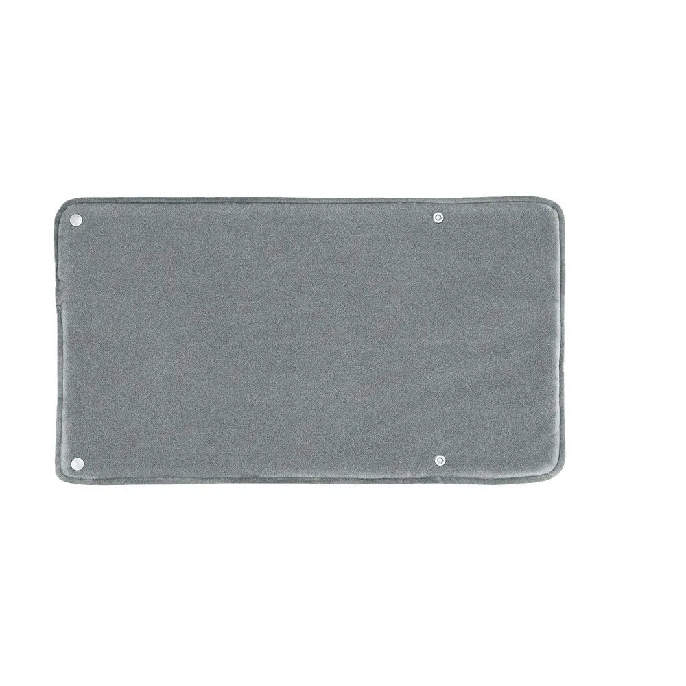 Tapis chauffant USB Somna glissé dans un lit pour réchauffer les draps