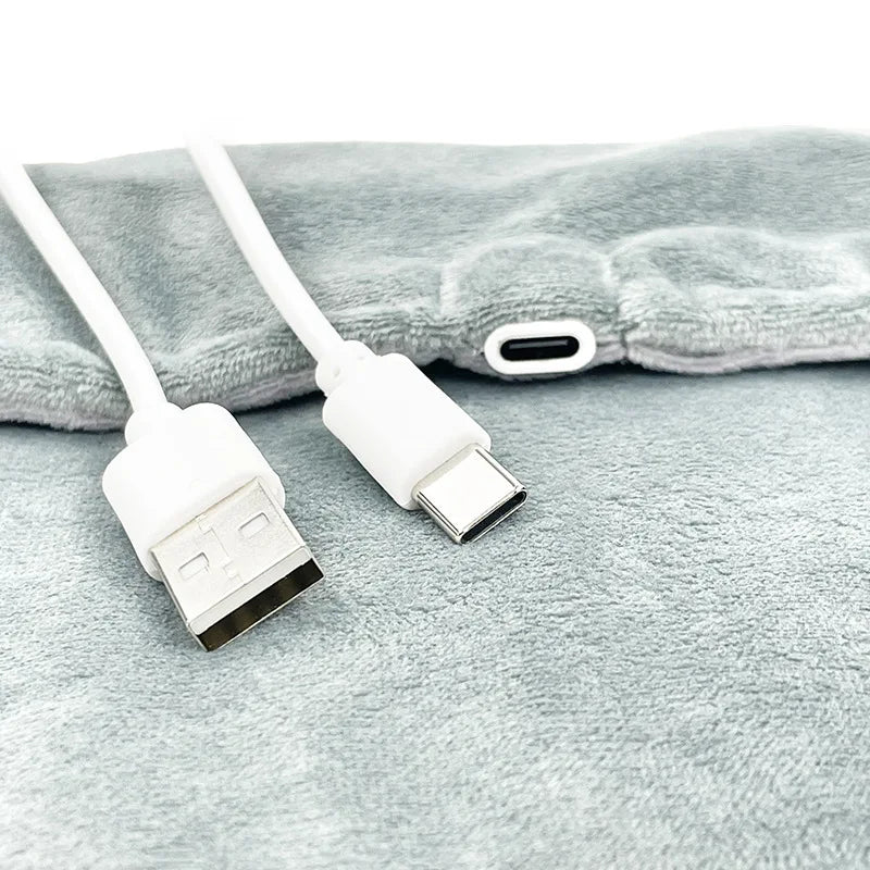 Tapis chauffant USB Somna glissé dans un lit pour réchauffer les draps