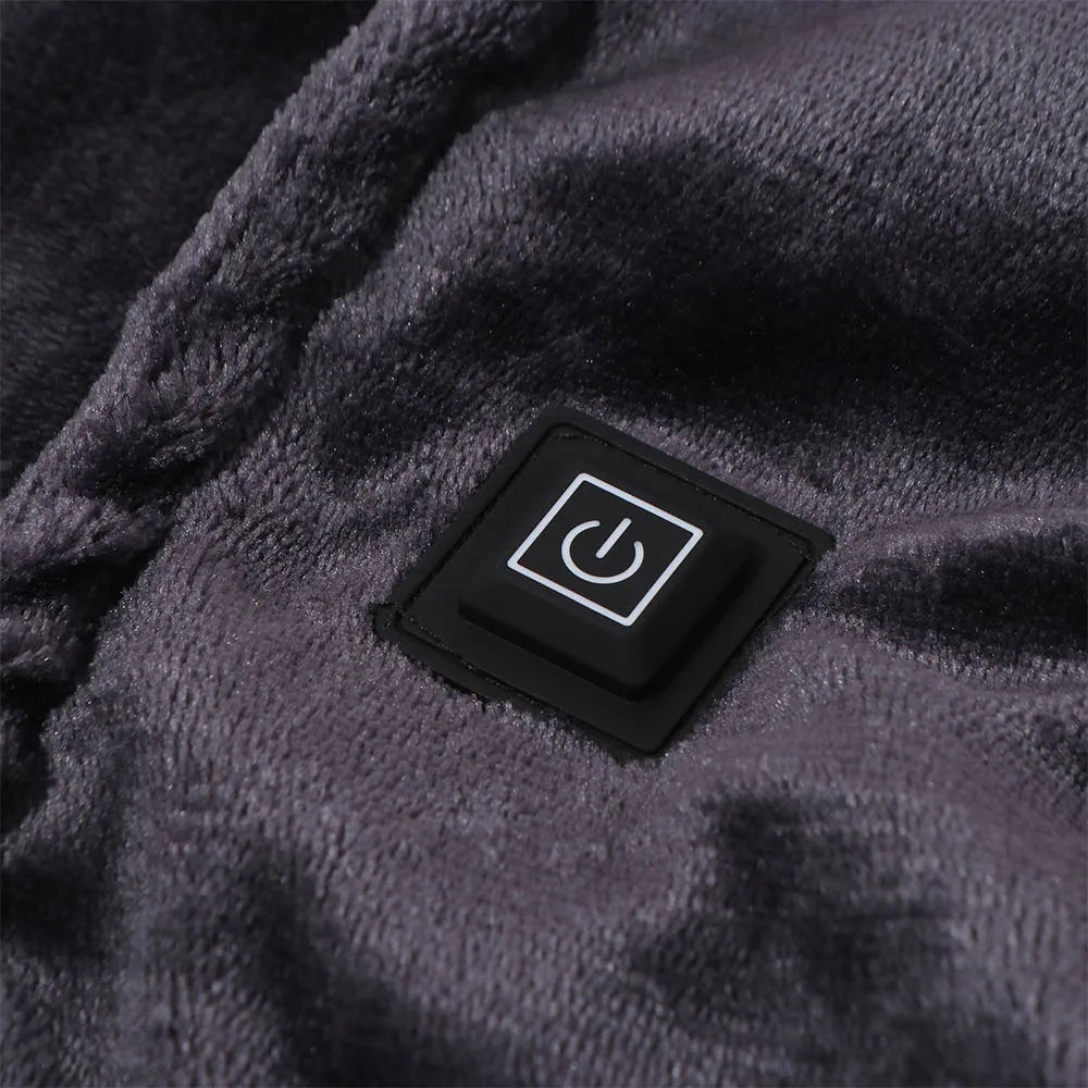 Tapis chauffant Somna en velours posé sur un divan dans une chambre douce