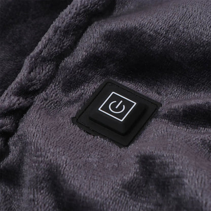 Tapis chauffant Somna en velours posé sur un divan dans une chambre douce